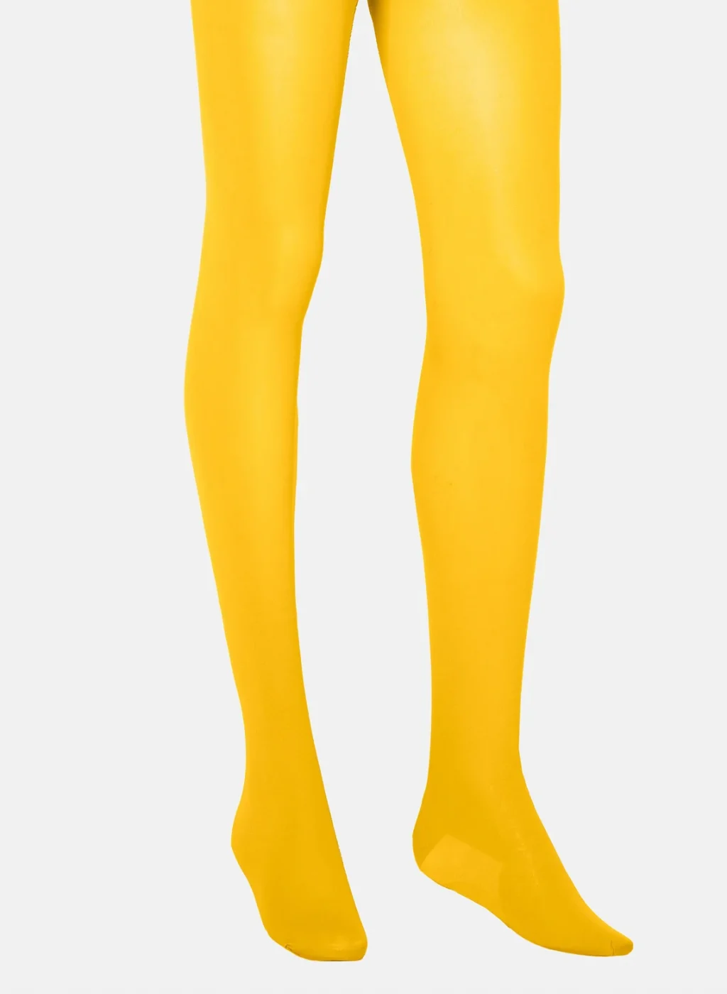 Pantimedias amarillas lisas sobre fondo blanco | Yellow opaque tights on white background